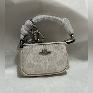 Coach Mini Nolita Bag Charm In Signature Canvas
SV/White/Chalk
